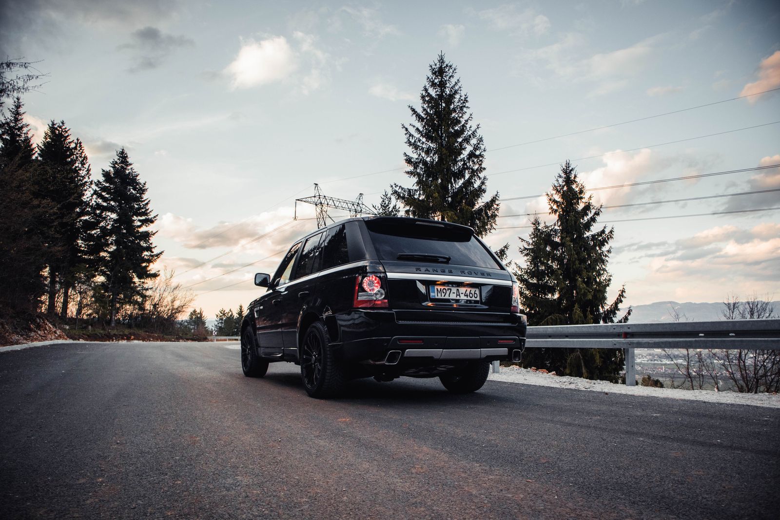 Black Range Rover on a mountain road